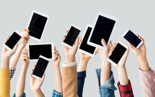 The image shows people’s raised arms and hands as they demonstrate their IOS devices. They express their satisfaction with the new sportsbook and IOS app