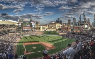 Comerica Park, the home field of the Detroit Tigers with Ford Field football stadium to the left and the Detroit skyline to the right.