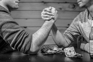 Men betting on arm-wrestling