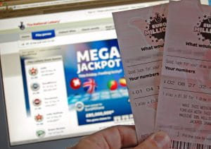 The numbers for the EuroMillions lottery checked online by someone with two physical tickets.