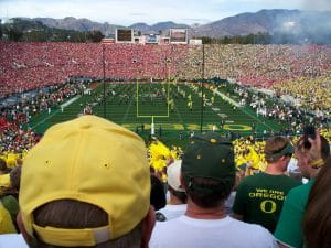 Oregon football fans watching the Oregon marching band perform during halftime of a Rose Bowl game