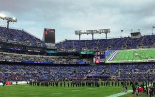 People gathering on the field of M & T Bank Stadium, home of the Baltimore Ravens.
