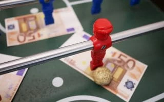Football table with money on it