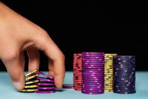 Man holding poker chips 