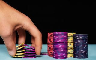 Man holding poker chips