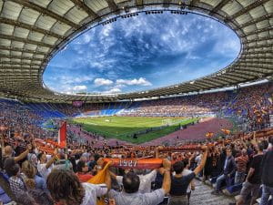 Sport fans watching a match in a stadium