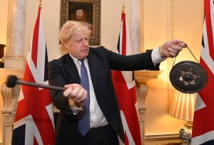 Boris Johnson in front of the British flag  