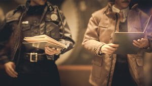 A Police Officer and a Detective Going Through Some Folders