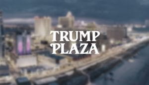 Trump Plaza Written Over a Blurry Shot of a Coastal Casino City 