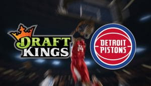 DraftKings and Detroit Pistons Daily Fantasy Logos over a Player Dunking