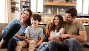 An UK Family at Their Home Watching Television