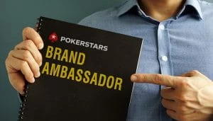 A Notebook with PokerStars Logo and Brand Ambassador Sign 