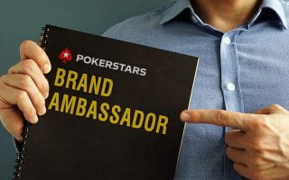 A Notebook with PokerStars Logo and Brand Ambassador Sign