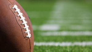 An American Pro Football Ball on a Football Field