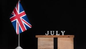 The UK Flag Next to a Sign Saying July 