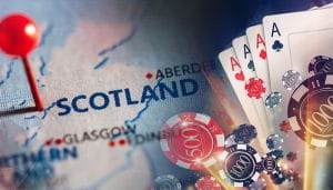 Scotland Pinned on a Map Next to Casino Elements 