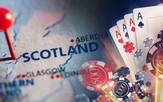 Scotland Pinned on a Map Next to Casino Elements