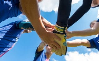 Teammates Salute Before a Game