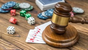 Gavel on a Table With Playing Cards, Dise, and Chips