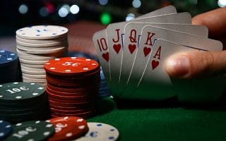 Checking Your Hand on a Poker Table with Chip