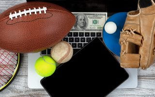 Sports Goods over a Laptop and a Hundred Dollar Bill
