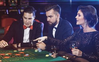 Gamblers on a Roulette Table in a Casino