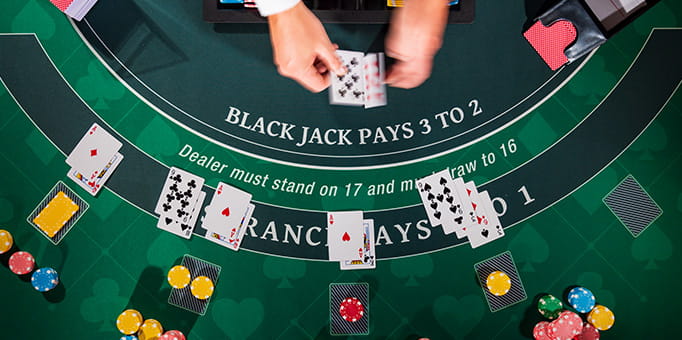 Blackjack Table with Dealt Hands 