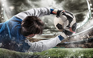 Image of a goalkeeper saving the ball