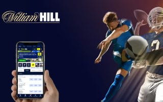 Logo William Hill melalui Telepon dengan Aplikasi Olahraga di sebelah Pemain Olahraga
