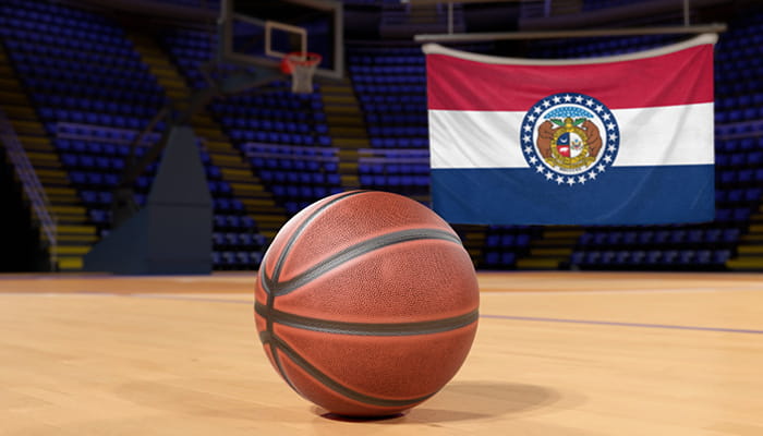 Image of a basketball hall with basketball and Missouri state flag at the background