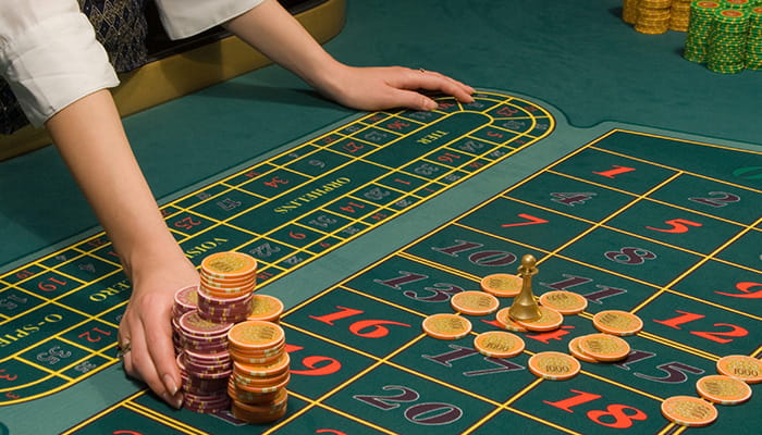 Casino Dealer Dealing Chips
