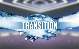 Transition Sign with Two Hands Shaking as a Background