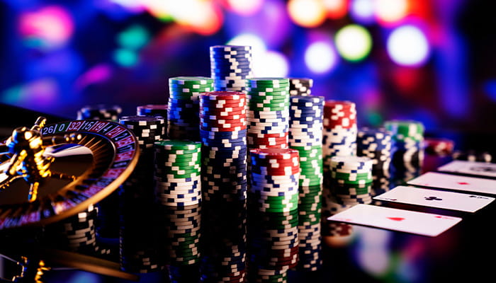 Gambling Elements Like Chips and Cards on a Shiny Surface Inside a Blurred Casino 