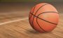 A close-up shot of a basketball placed on the court