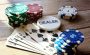 Poker cards, chips and buttons on a table