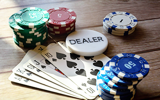 Poker cards, chips and buttons on a table