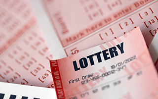A lottery ticket and pen
