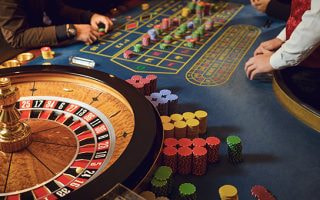 An image of a roulette wheel and table