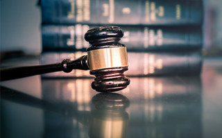 A gavel and two books