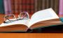A pair of glasses on a book