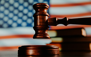A Gavel With the American Flag in the Background